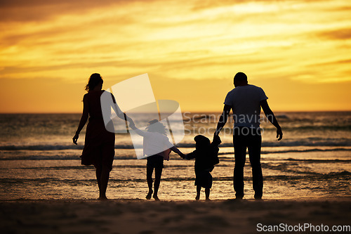 Image of Family, holding hands and silhouette at the beach at sunset, adventure and love with parents and children outdoor. Mother, father and kids together, trust and freedom by the ocean, nature and care.