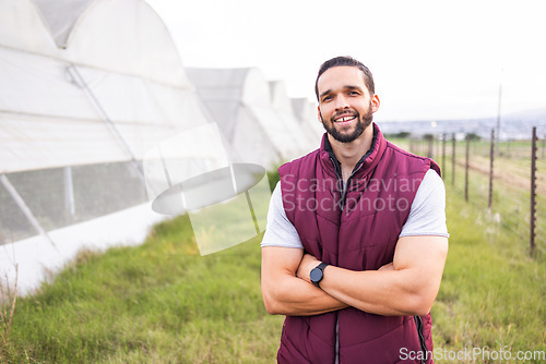Image of Farmer, greenhouse farm and portrait of happy man on firle outdoors. Young sustainability farming, eco friendly business owner and carbon capture lifestyle on agriculture countryside land in summer