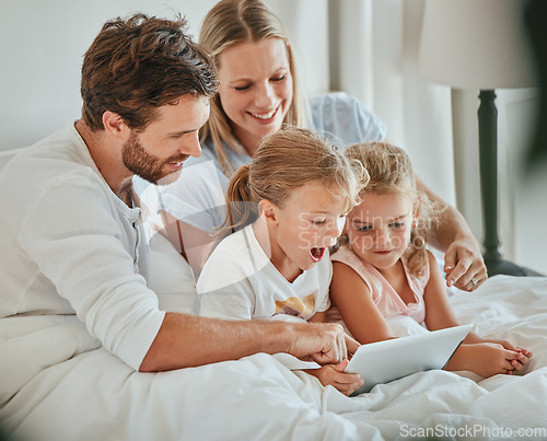 Image of Parents, kids and tablet learning in bedroom, games and watching cartoons on internet, online and relax at home. Happy family of mom, dad and excited children, digital fun and educational app on tech