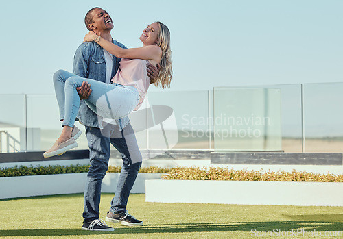 Image of Love, carrying and fun with a couple laughing or joking together outdoor in summer for bonding. Dating, happy and romance with an affectionate young man and female enjoying funny humor outside