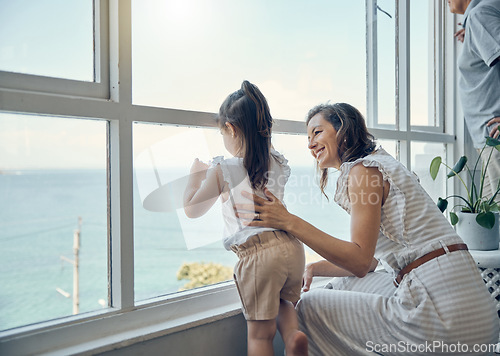 Image of Family view, window and mother with child bonding, having fun and enjoy quality time together in home living room. Mamas love, happiness and mom with kid girl watch the ocean through glass window
