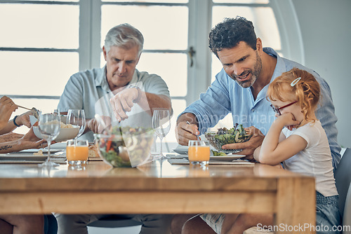 Image of Dinner, family and child eating food at dining room table together at retirement home. Senior grandparent, happy father and young girl upset about conversation or dad teaching child healthy lifestyle