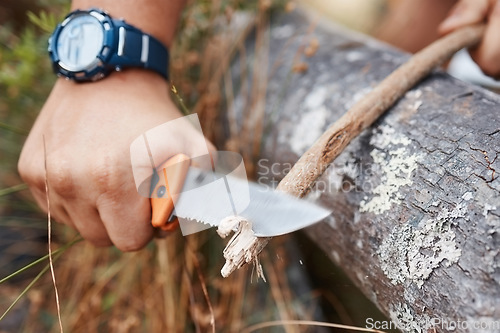 Image of Camping man, knife and cut wood, tree branch and sharp stick for campfire, hunting and outdoor hiking. Hiker hands, sharp tool and carving plants in nature, forest or survival woods, weapon and spear