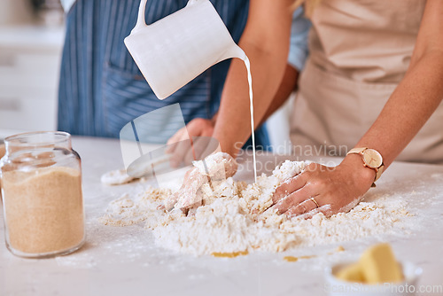 Image of Couple bake together, hands with dough in kitchen, for bonding and learning to be baker and baking skill together. Man, woman with flour and butter for pastry or bread, with cooking for love and fun.