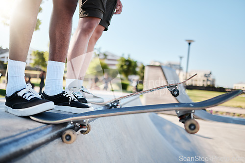 Image of Fitness, shoes and skateboard friends training at skateboard for health, exercise and hobby in summer. Feet, balance and men stepping for halfpipe, skating and prepare body for physical performance