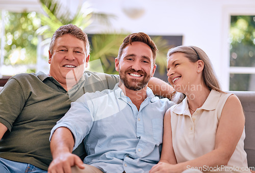 Image of Happy family, portrait and adults relax on a sofa with senior couple, son and laughing in a living room, quality time and adults. Love, face and family on a couch, bonding and happy in their home