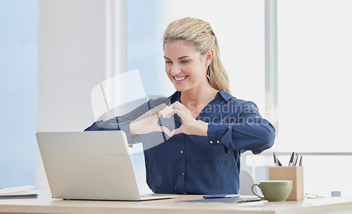 Image of Laptop, hand heart and business woman in an office, smile and happy while on video call with investor for startup. Hands, love and woman entrepreneur showing thank you sign in a video conference