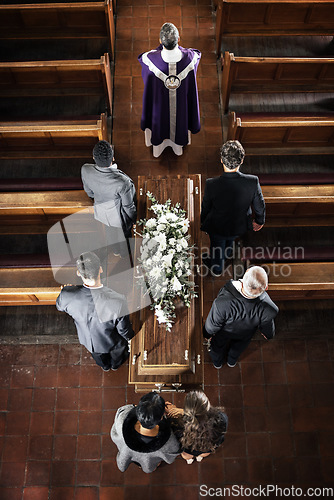 Image of Funeral, church and sad people carrying coffin with a priest, pallbearers and church pew from above, death, mourning and day of remembrance. Church service, casket and grieving family and friends