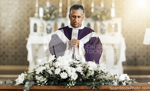 Image of Funeral, prayer and pastor in a church for worship, farewell and praying over a coffin. Pray, death and church service by a priest talking, offering comfort and spiritual guidance at funeral service