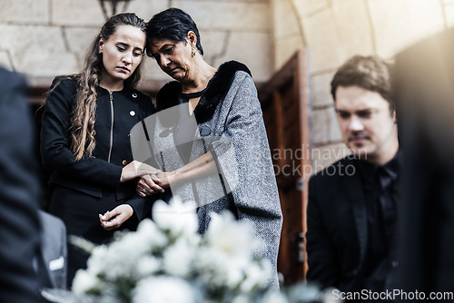 Image of Funeral, senior mother and woman sad, crying and death in family, church and grief for loss of life. Young female comfort, care and support elderly mom after ceremony or service outdoor a chapel