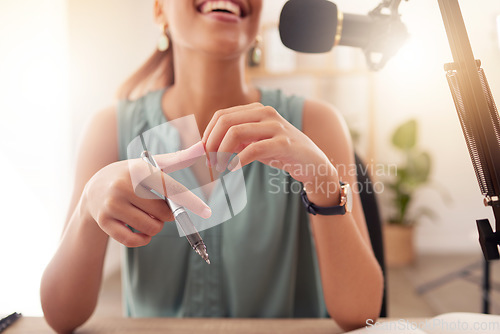 Image of Woman, radio host and podcast on microphone in office, broadcast studio or journalism press company. Happy smile, journalist and influencer talking on media speaker, news or audio communication tech