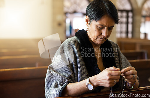 Image of Pray, senior woman and praying in church with a rosary for religion, worship and God praise, peaceful and calm. Holy, peace and prayer by Mexican female in chapel in Mexico for spiritual blessing