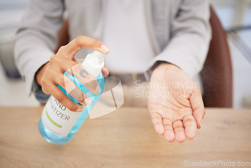 Image of Hand sanitizer, safety and spray business woman at desk for bacteria, covid or healthcare. Cleaning, disinfection and employee hands and antibacterial soap for hygiene, virus or pandemic prevention