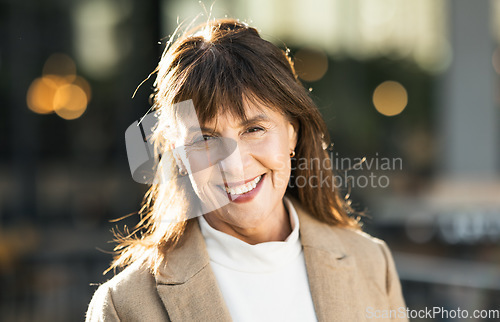 Image of Portrait, mature woman and businesswoman in the city commuting to work or her office. Face, front and executive or leading traveling female in an urban town for travel to professional workplace