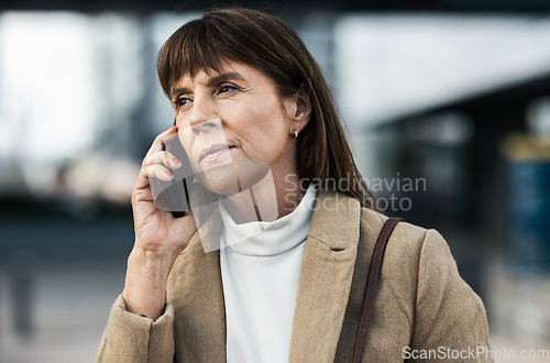 Image of Phone call, city and serious senior woman in professional communication with legal client on mobile. Lawyer, thinking and listening to 5g smartphone conversation on urban town commute.