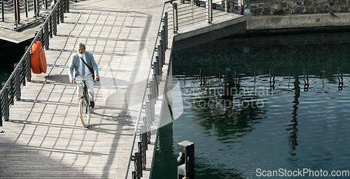 Image of Businessman, asian and eco bike travel on bridge for carbon neutral work transportation in China. Worker, cycling and river commute with senior executive on outdoor sustainability trip with bicycle.