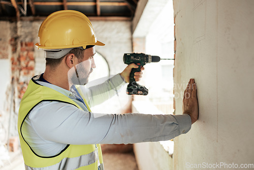 Image of Construction worker, man or drilling wall with electric tool for utility lines, pipes or duct work in office building property. Engineering worker or architect drill on real estate construction site