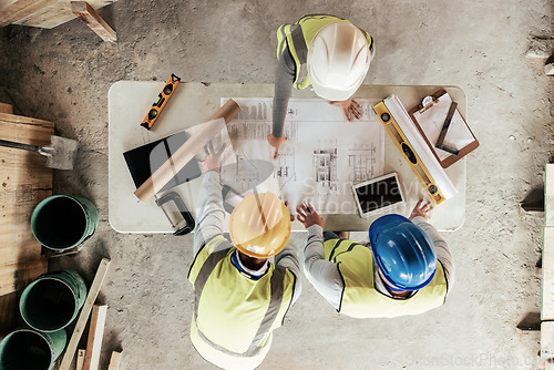 Image of Top view, construction workers or blueprint planning in house, home or office building in real estate, property or architecture innovation. Men, engineering woman or construction site people or ideas