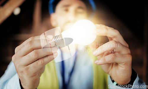 Image of Idea, light and man engineer holding a lightbulb for vision, innovation and construction. Contractor, construction worker and designer lights for a maintenance project with an architect and bulb