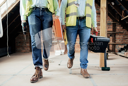 Image of Construction, team and legs of engineers walking on the building site for home renovation project. People, construction worker teamwork and feet of men walking in industrial building for maintenance