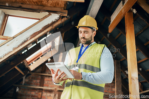 Image of Tablet, construction and building with a man engineer working online on a building site from below. Construction worker, architect and industry with a male technician planning design while at work