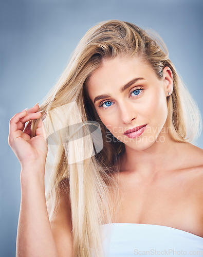 Image of Salon, hair and woman on with care for hairstyle and strength on a grey studio background. Haircare, hair style and beauty woman with healthy blonde hair for glamour and cosmetic treatment