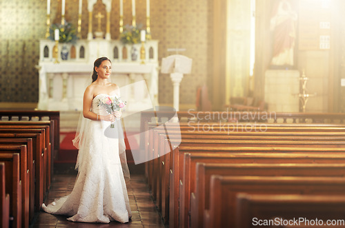 Image of Wedding, bride and church with a woman holding flower bouquet while thinking about marriage, future and dream before walking down the aisle. Model in a white wedding dress for commitment and ceremony