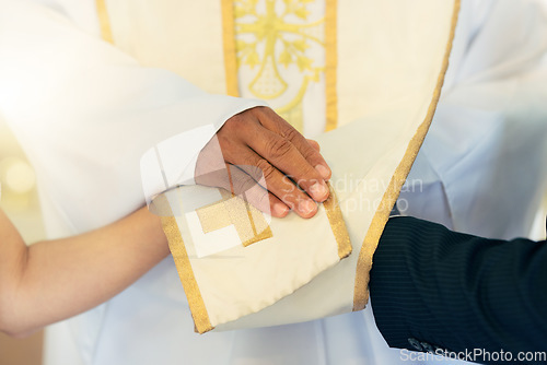 Image of Hands, priest and couple while praying, wedding and commitment in church for marriage blessing. Christian pastor prayer for man and woman in ceremony, spiritual and religion event in a service