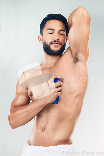 Image of Beauty, deodorant and man spray for body hygiene, perfume and clean armpit product marketing. Cosmetic, grooming and healthy model smelling fresh scent for advertising with gray studio mockup.