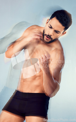 Image of Body, strong and boxing with a man muscular model in studio on a gray background for health or fitness. Sports, muscle and training with a male athlete or boxer punching during an exercise workout