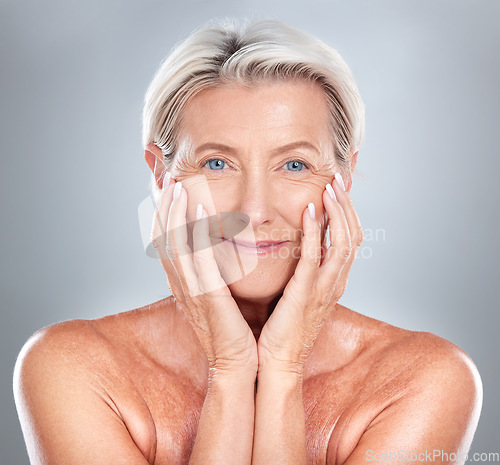 Image of Skincare, beauty and face of a senior woman with wellness, health and smile against a grey studio background. Relax, dermatology and happy elderly person in retirement with cosmetology to relax