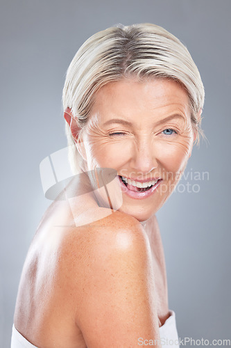 Image of Wink, funny and senior beauty woman face happy about skincare and wellness. Portrait of an elderly model from Scandinavia with happiness of dermatology, skin health and anti aging treatment