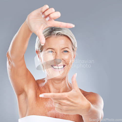 Image of Picture hand face frame, happy and senior woman with a smile from skin wellness and beauty. Portrait of a elderly person model feeling happiness from skincare and anti aging cosmetic treatment