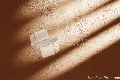 Image of Orange concrete facade with sunlight shadow background. Indoor s