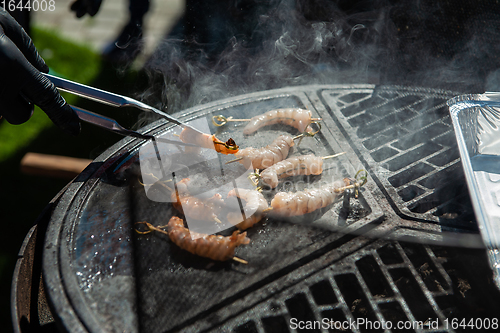 Image of A professional cook prepares shrimps