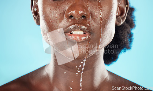 Image of Water, mouth and face of a black woman with drops on her lips for hygiene, grooming and cleansing. Beauty, skincare and hydrating facial for an african american female with oral cleaning treatment