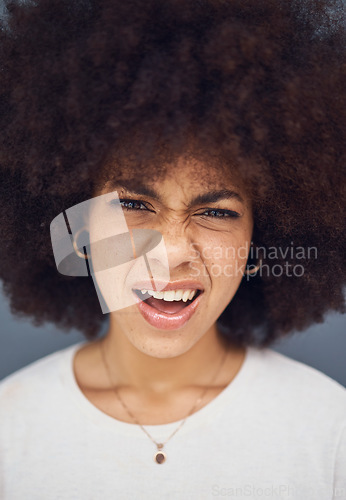 Image of Confused, afro and face of a woman thinking of a decision against a grey studio background. Doubt, uncertain and portrait head of a young girl looking puzzled, doubtful and with a facial reaction