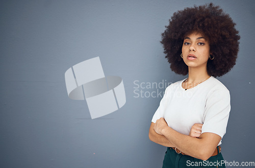 Image of Black woman, business leader and arms crossed by advertising, marketing and mockup space for power and leadership. Portrait of African, model with natural afro, hair for product placement mock up