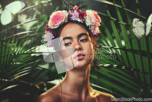Image of Beauty, nature and crown flower on woman in nature jungle for skincare, health and wellness with tropical dermatology product, cosmetics or makeup. Aesthetic spring model with natural floral mockup