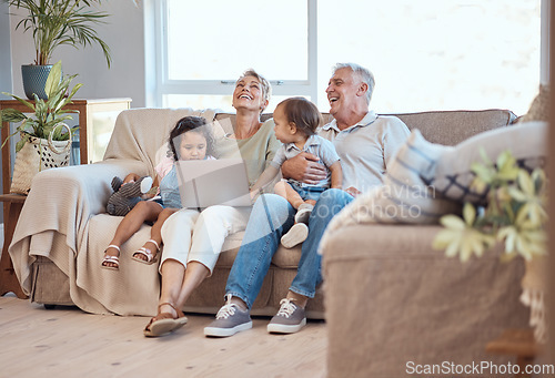 Image of Happy, family and laptop on the sofa with children and grandparents on home sofa. Senior man and woman relax online with their adopted grandchildren while watching funny movie, streaming or cartoon