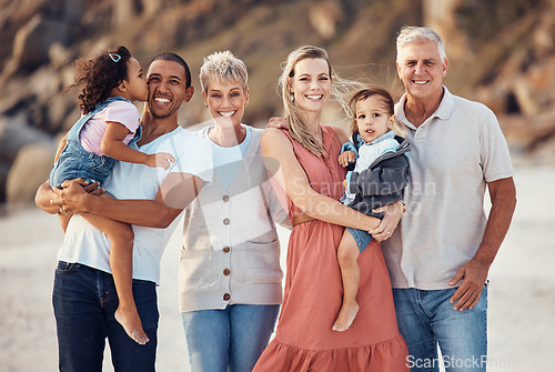 Image of Interracial family, beach smile and children together on a bonding with happiness and kid care. Portrait of a happy, vacation and parents with senior grandparents holding kids with love outdoor