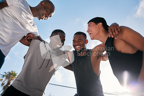 Image of Happy, team building and fitness men on a basketball court planning a strategy, mission and goals in a training game. Sports, mindset and healthy athletes laughing, talking or speaking of a mission