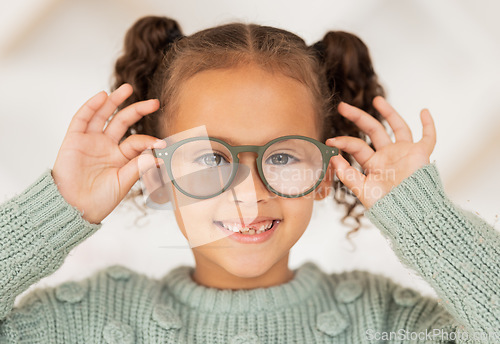 Image of Vision, eye care and portrait of child with glasses for optical healthcare, eyesight support and test prescription eyeglasses. Optometry store, retail choice and happy youth girl trying on lens frame