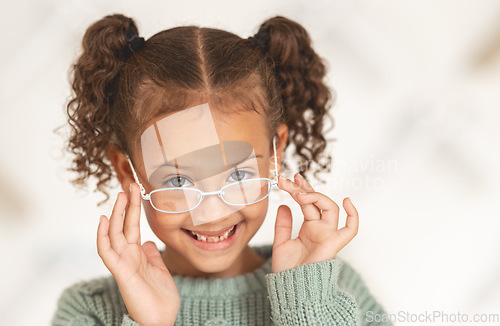 Image of glasses, child face and eye care for vision in optometrist office. Excired young girl, happy and smile for eye exam, eyes healthcare treatment and optometry lens fashion portrait for wellness support