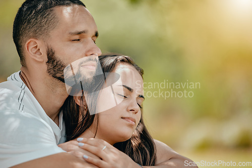 Image of Nature, love and young couple rest in park enjoying weekend, freedom and holiday together. Romance, bonding and man and woman hugging, embracing and holding each other with closed eyes outdoors