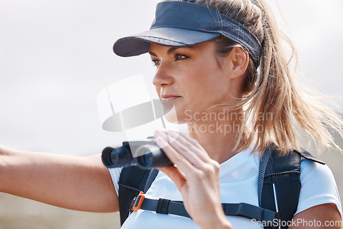 Image of Binoculars, hiking and woman travel in nature for bird watching, trekking and safari adventure. Female hiker sightseeing in park distance, search experience and direction for tourist journey outdoors