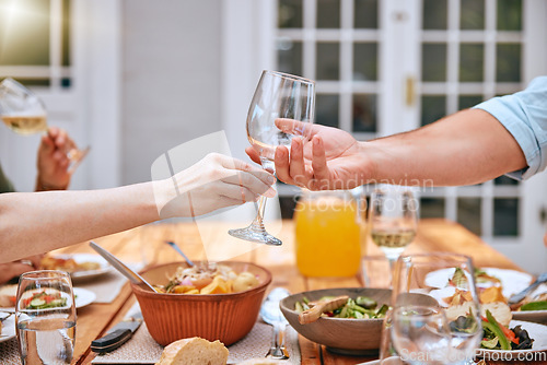 Image of Wine glass, food and outdoor lunch of a man and woman hand ready for wine and eating. People couple hands help at the table for thanksgiving with alcohol drink and friends on a home patio in summer