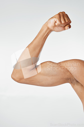 Image of Fitness, muscle and arm bicep in studio, isolated on white background for exercise, workout and training. Strength, power and strong body of muscular man flexing for bodybuilding, gym and wellness