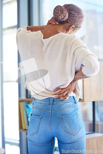 Image of Black woman, back and neck pain in stress, tired or overworked from working at home. African American female suffering from muscle tension, discomfort or ache in burnout or mental health issues