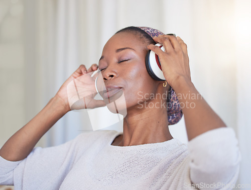 Image of Music, headphones and black woman listening to radio sound, wellness audio podcast or gospel soundtrack. Stress relief, relax and African girl streaming song for peace, freedom and healthy mindset